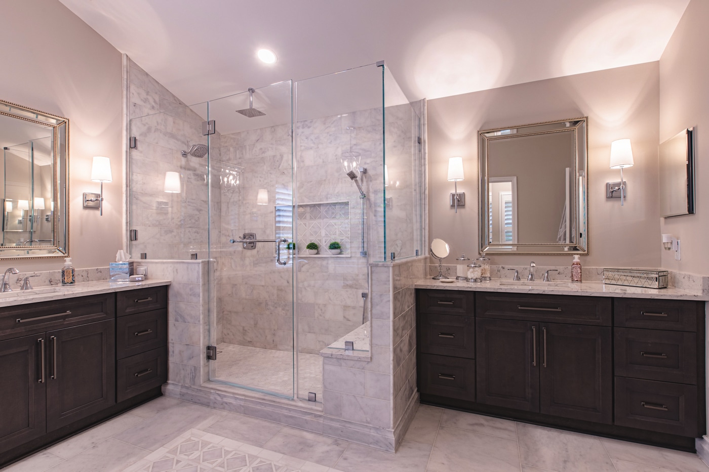 a bathroom with two sinks and a shower