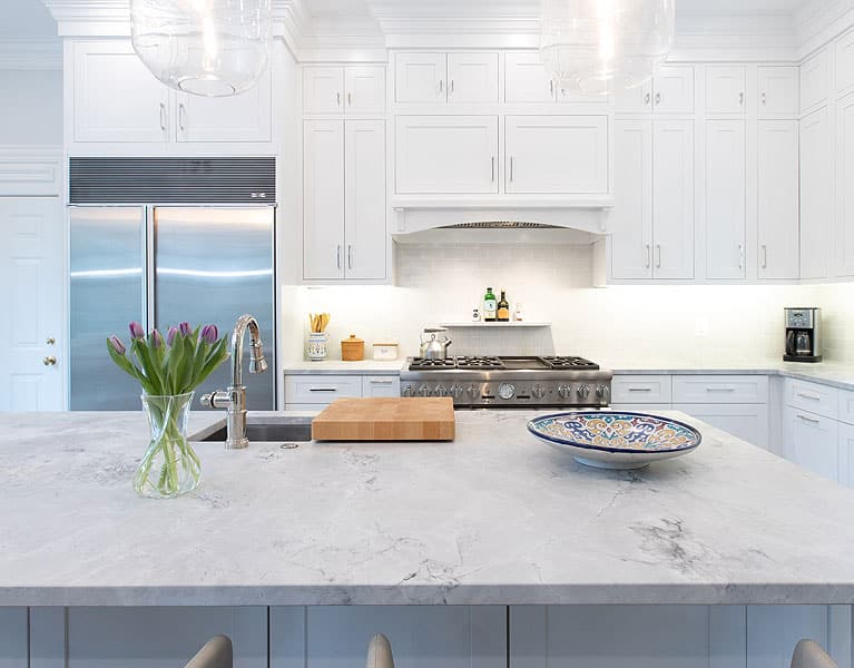 White Kitchen Cabinets with granite countertops and sinks