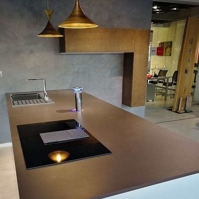 Dekton 10 A contemporary kitchen featuring a spacious island and sink