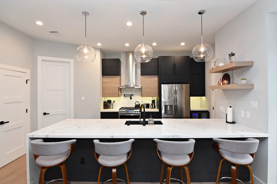 Close-up of Ultracraft black matte cabinets with slab door style in Houston