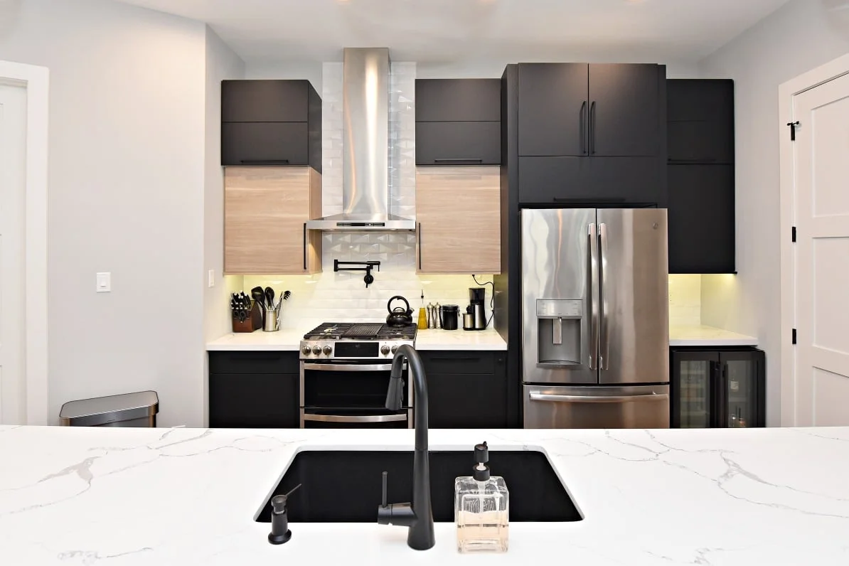 CMD Group Clacatta Lunari countertop with black matte Ultracraft cabinetry in Houston