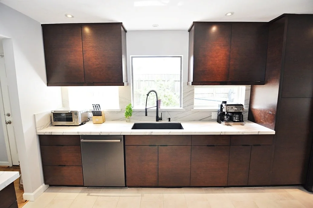 Finished Houston brown kitchen remodel by USA Cabinet Store featuring Ultracraft bamboo cabinets