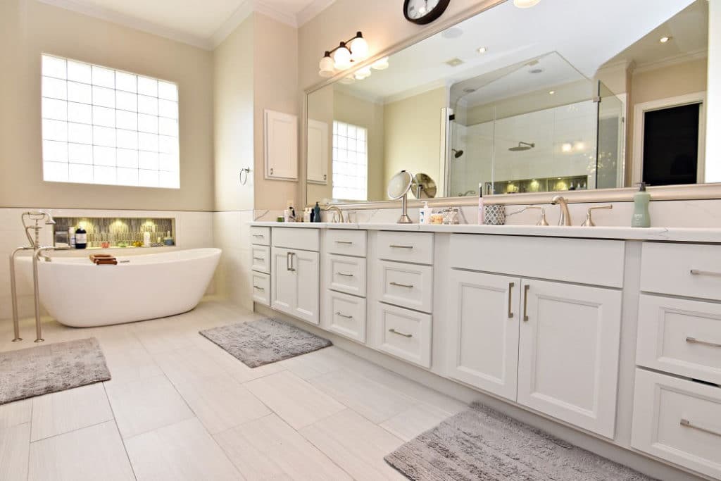8 Bathroom Cabinet Ideas and Designs For Storage 86 White bathroom cabinets with a large tub and a large mirror