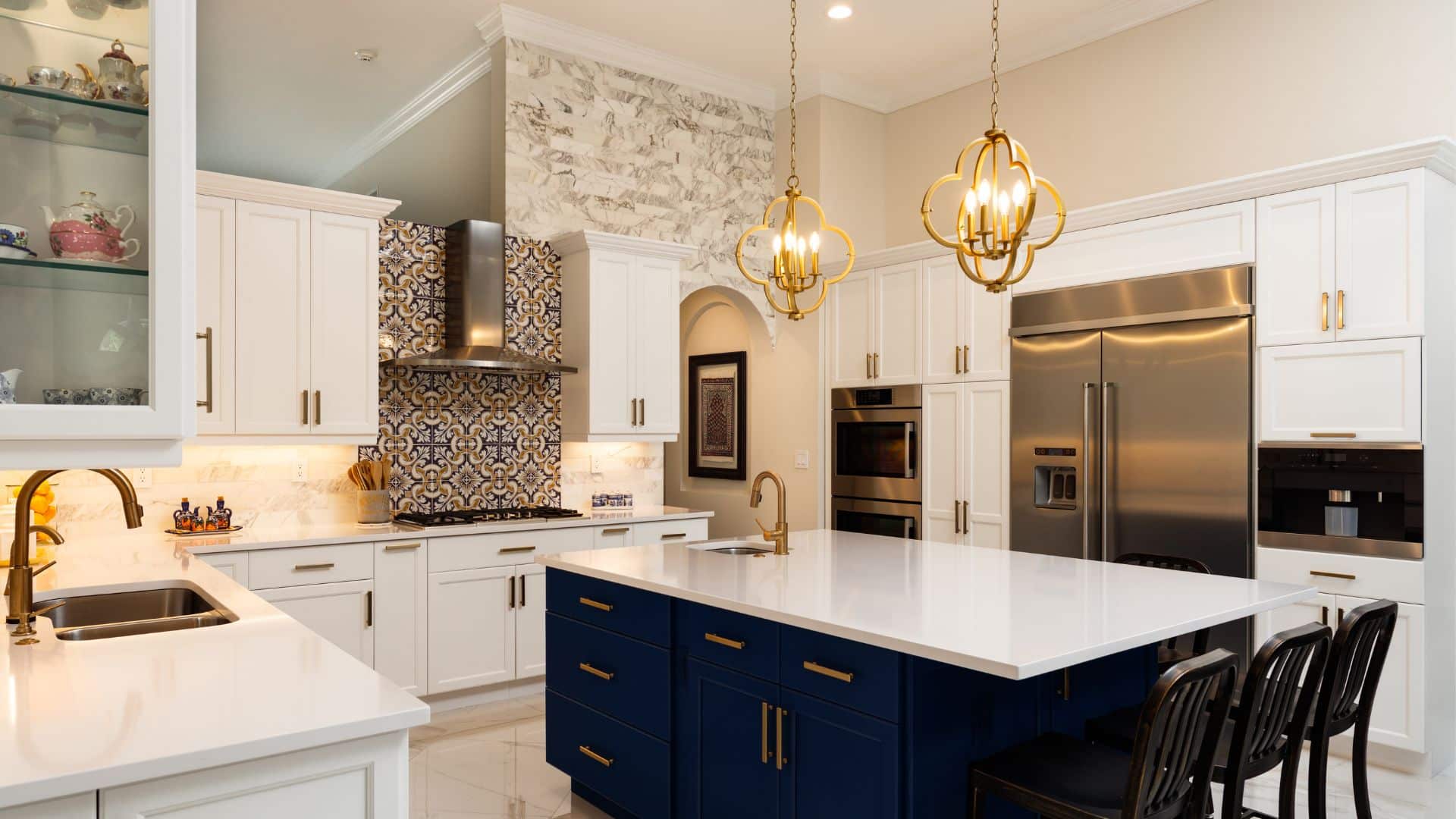 White Upper Cabinets with Navy Blue Lowers and Golden Accents
