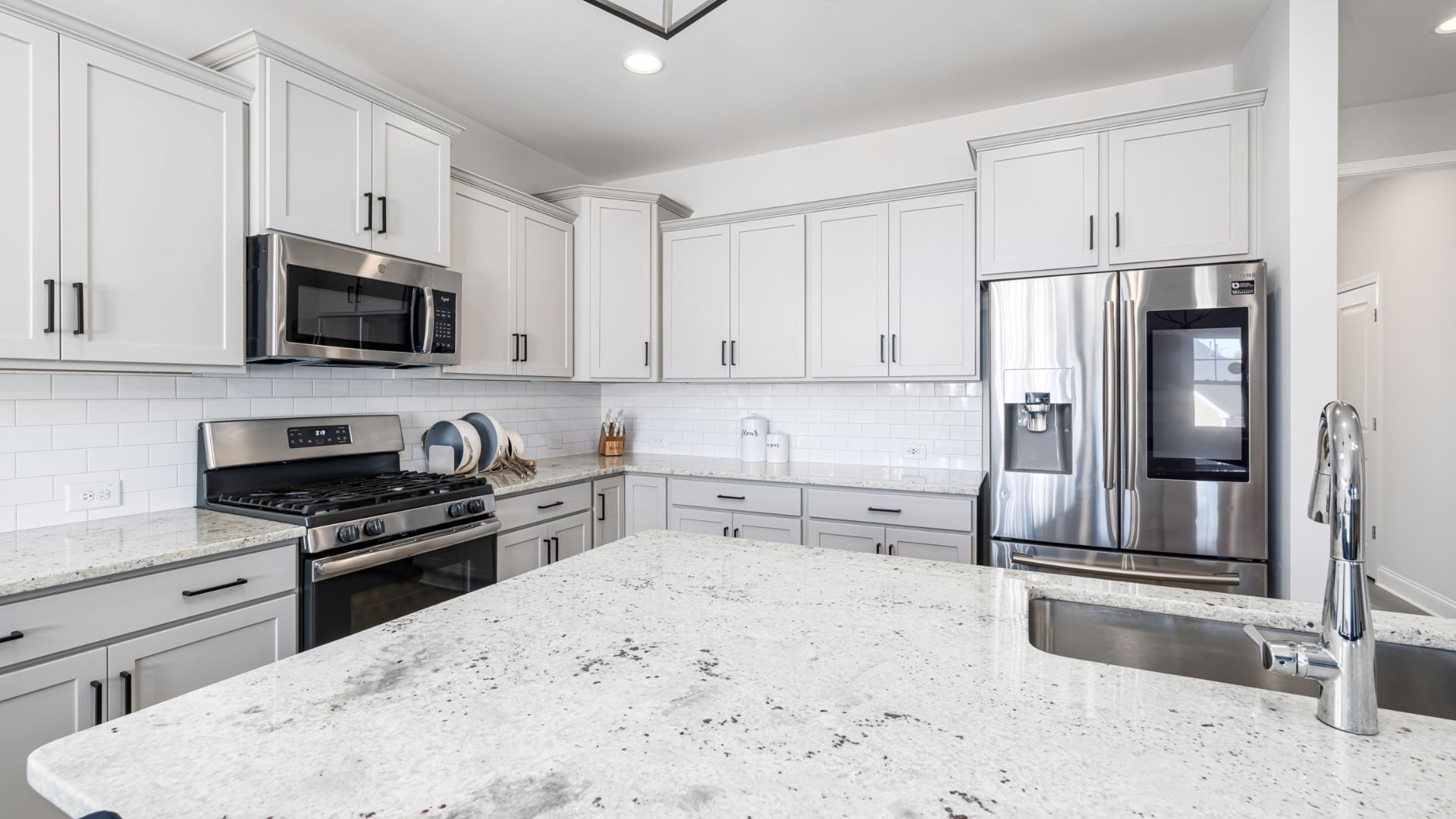Cabinetry 9 kitchen with white cabinets and a stainless steel sink