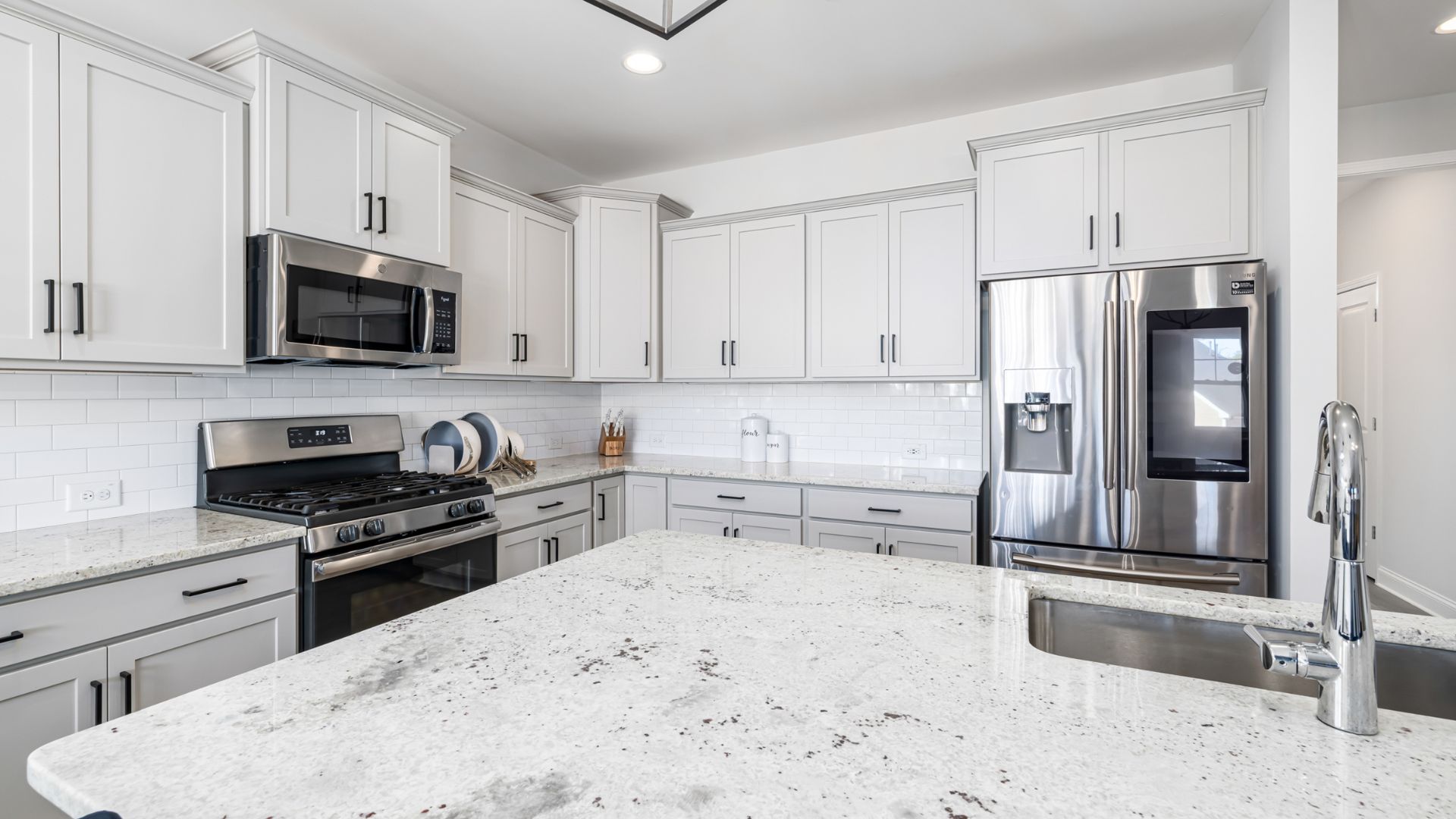 kitchen with white cabinets and a stainless steel sink