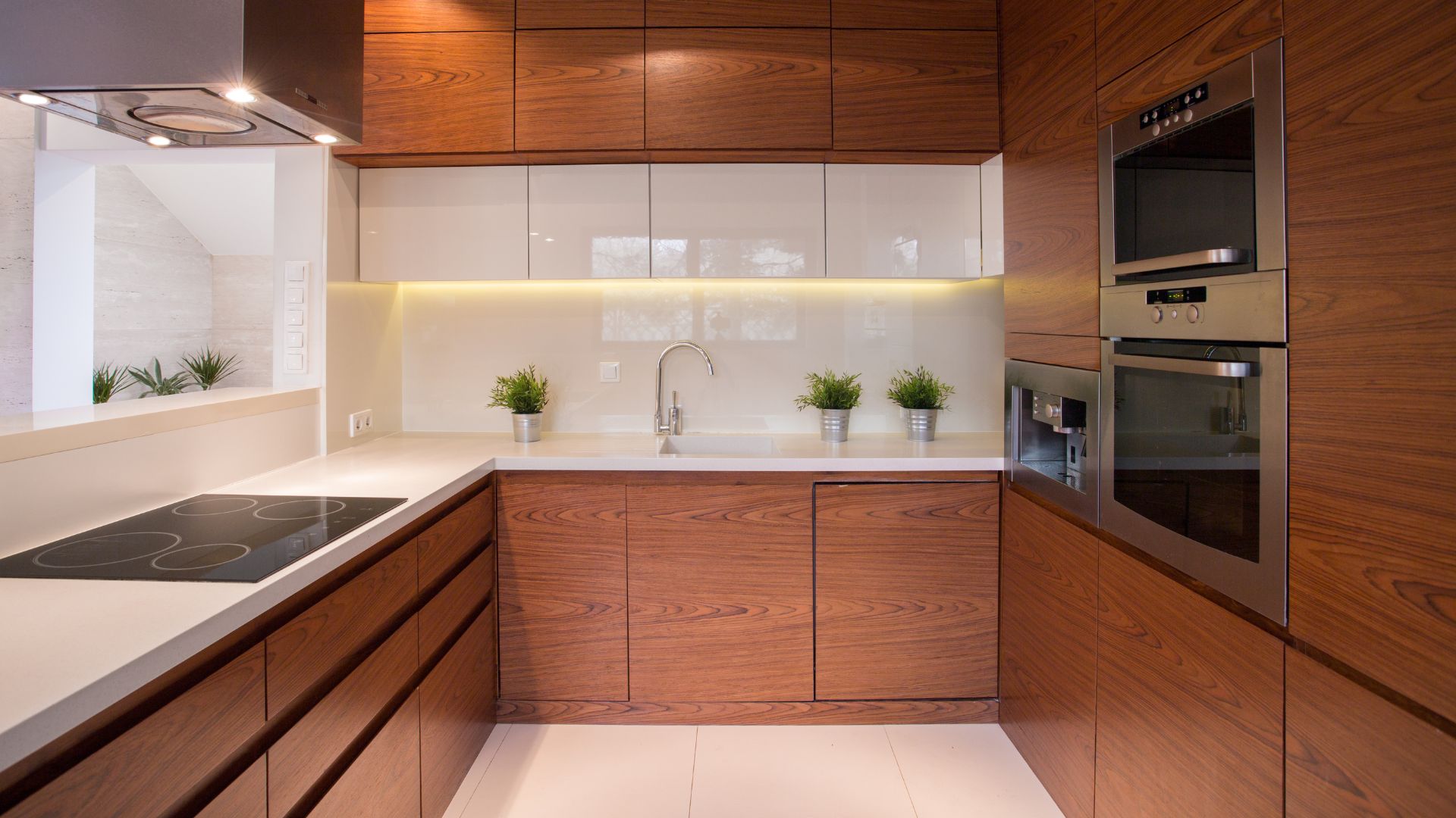 Cabinetry 10 Frameless Brown Kitchen Cabinets with a sink
