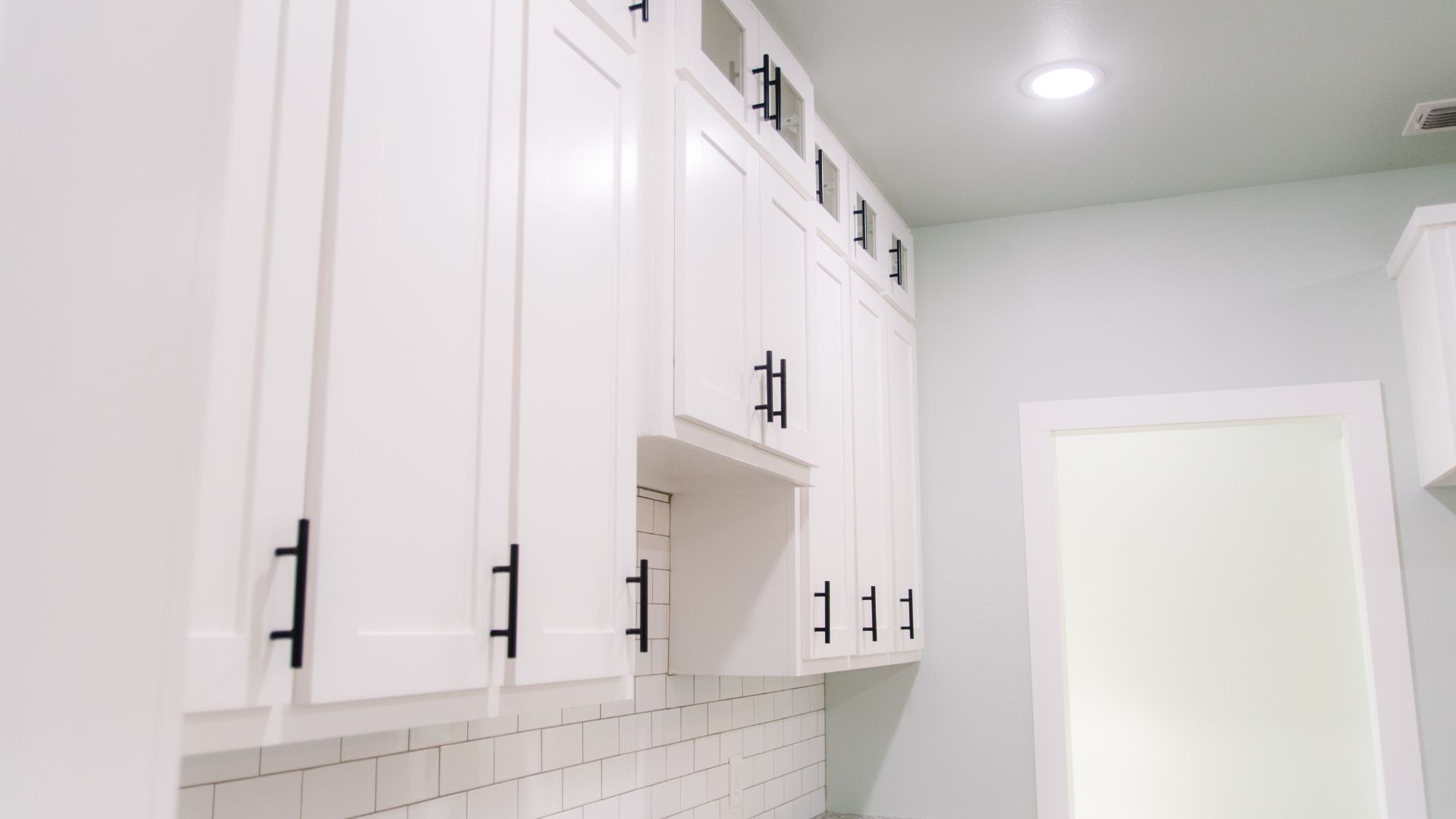 Cabinetry 6 kitchen cabinets with black handles