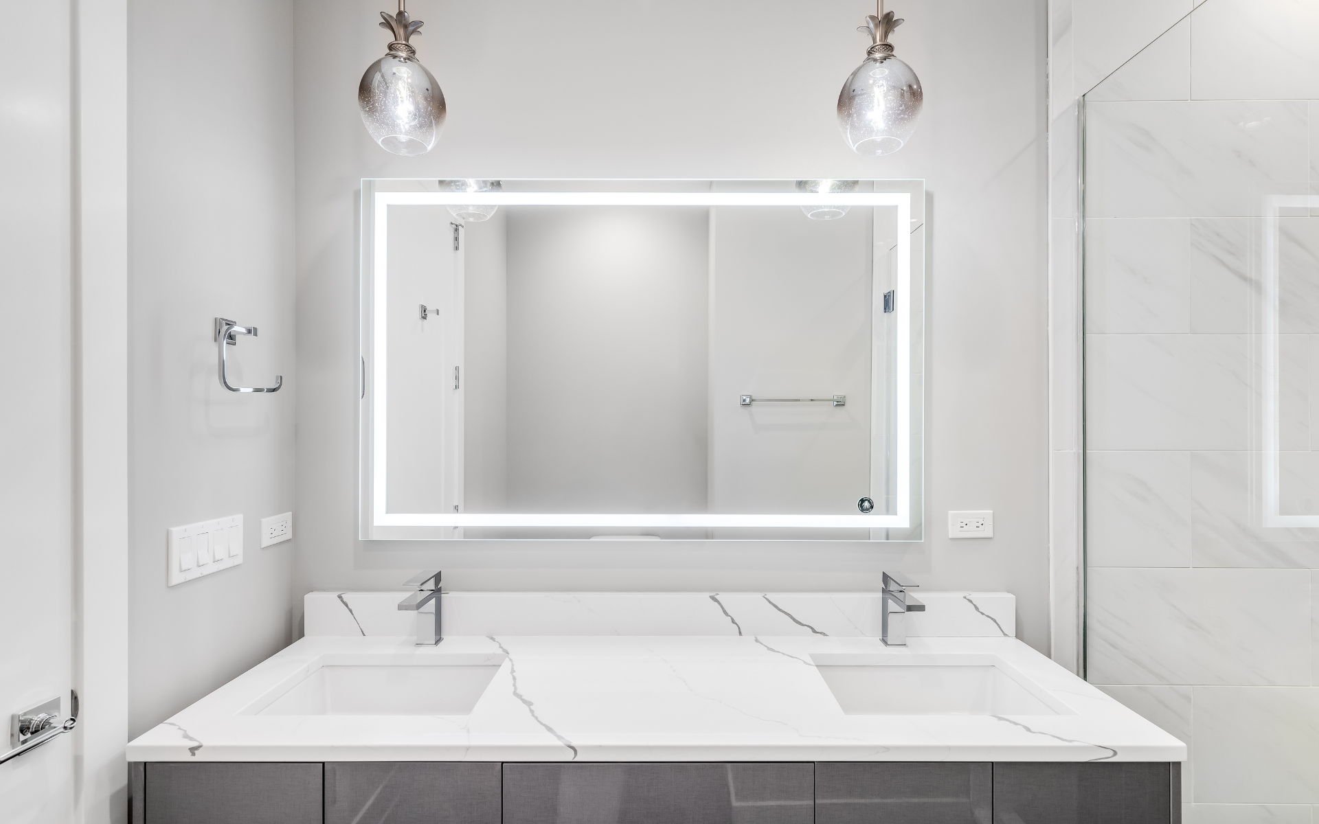 What type of vanity lighting should I choose for a rental bathroom