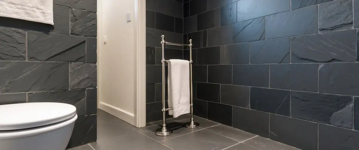 bath with black slate tiles