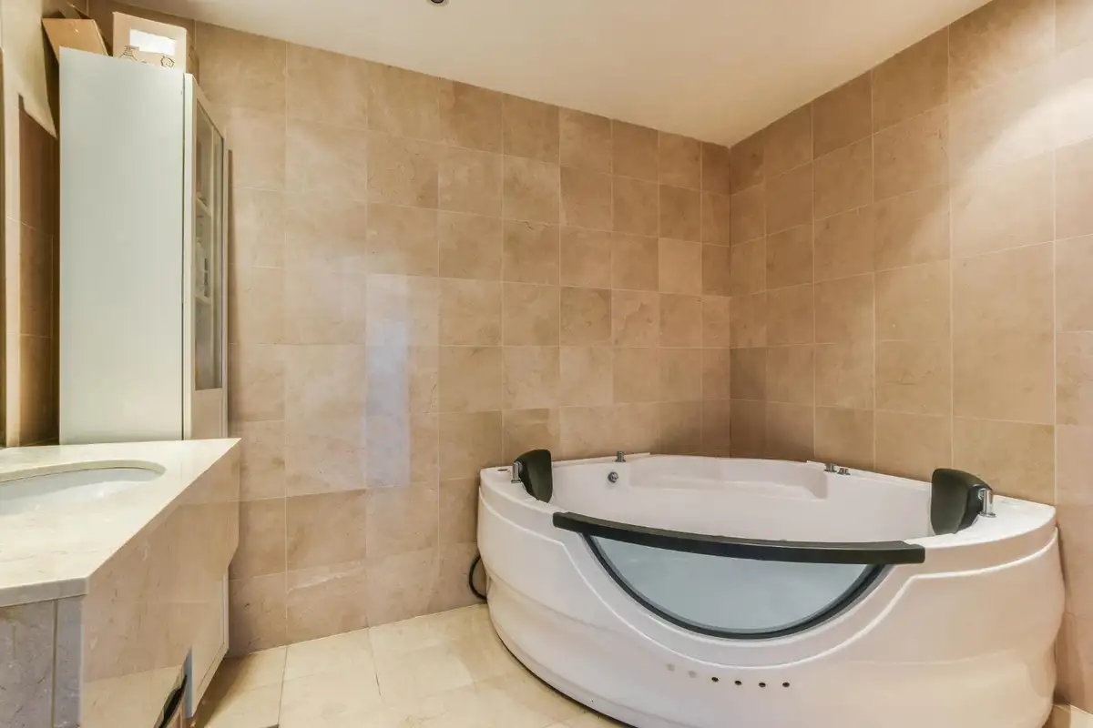 bathroom with travertine tile