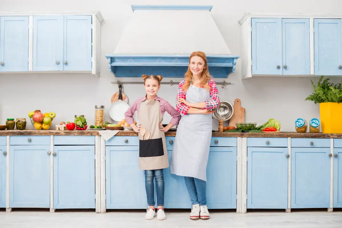 small blue kitchen with light color cabinets