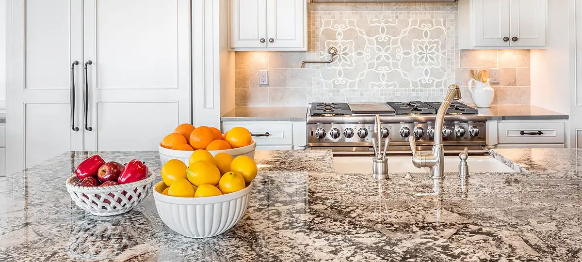 black and beige granite countertop in a small kitchen