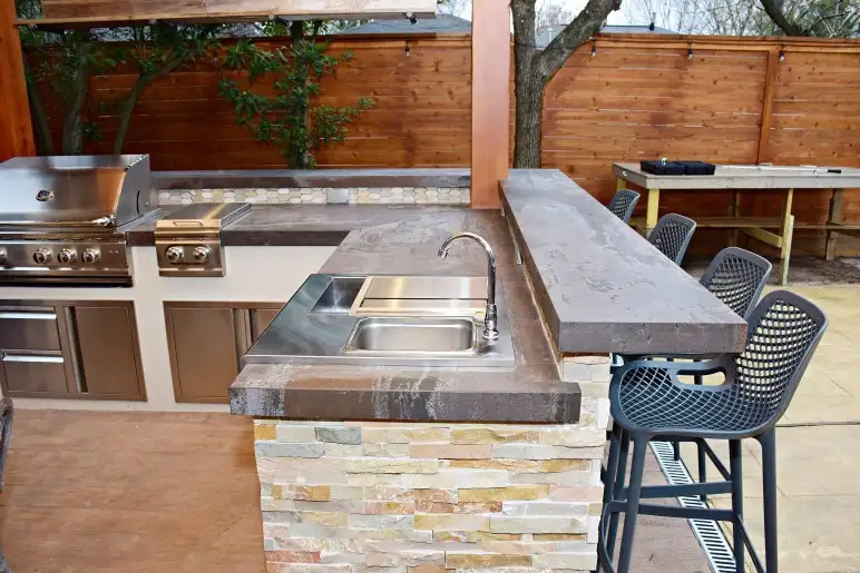 grey concrete countertop in outdoor kitchen
