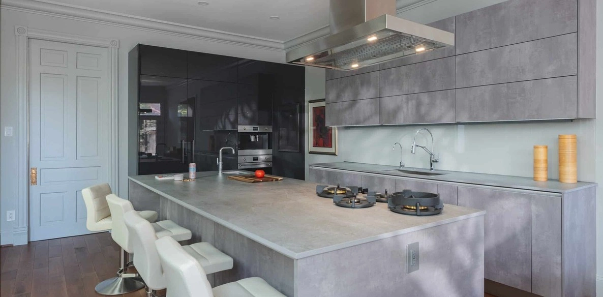 grey kitchen mostly covers with laminate materials on its surfaces