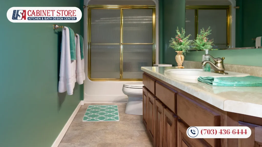 How to Plan a Bathroom Remodel in Fairfax: 9-Step Guide 33 Traditional Fairfax bathroom remodel featuring green walls, wood vanity, and brass shower trim.