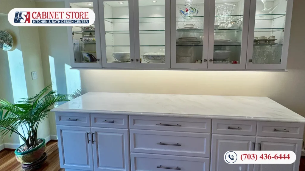 Best Kitchen Remodel Contractor in Fairfax, VA: How to Choose 13 Traditional kitchen with a black island, dark wood cabinetry, granite countertops, and a dining table set.