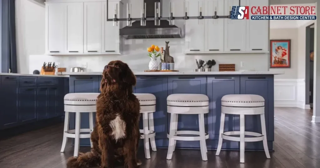 Turnkey Kitchen Remodeling Services in Fairfax County 1 Navy blue kitchen island with white swivel bar stools and a large brown dog.